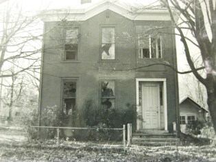 302 W 1st Street early in 1973 before the scavengers and looters ripped the front door off the home.